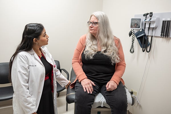 Dr. Naz consulting with patient