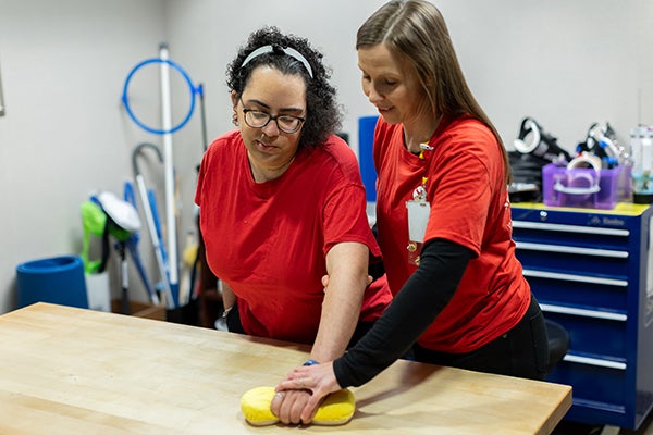 Kelly helping Jazmine Perform Therapy