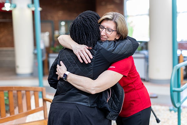 April hugging Yamicka