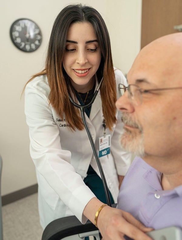 Dr. Khan checking Doug's heart