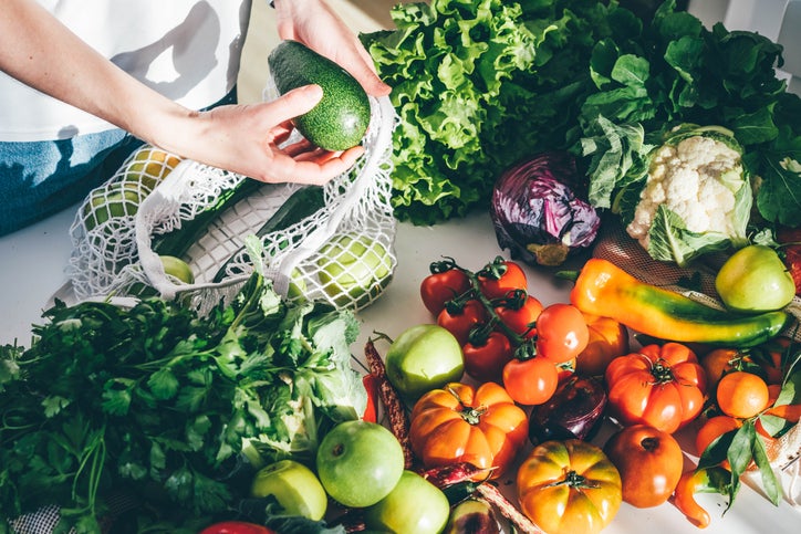 woman purchasing vegetables