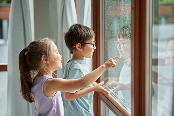 Children looking out of a window