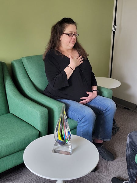 patient posing for chair yoga